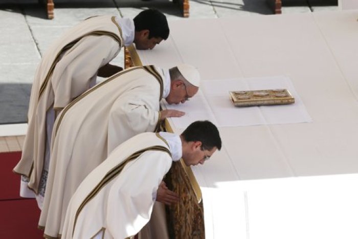 Pope Francis kisses the altar in Saint Peter's Square during his inaugural mass at the Vatican, March 19, 2013. Pope Francis celebrates his inaugural mass on Tuesday among political and religious leaders from around the world and amid a wave of hope for a renewal of the scandal-plagued Roman Catholic Church.