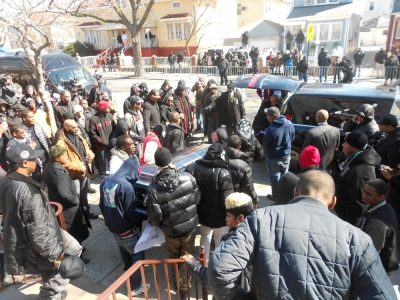 Friends and family of slain teen, Kimani Gray return his body to a hearse after his funeral in East Flatbush, Brooklyn, N.Y. on Saturday. Kimani Gray was shot dead by two undercover NYPD officers on March 9.