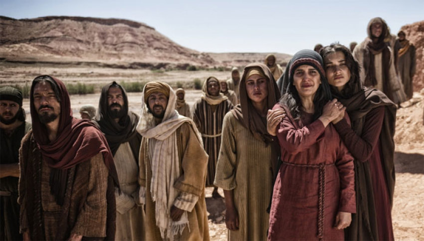 Martha and the Disciples wait outside Lazarus' tomb in a scene from The History Channel's