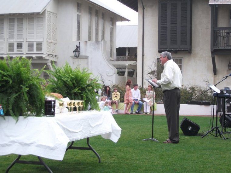 Pastor Mike Young ministers at a open air Easter service hosted by Chapel at the Beach in Rosemary Beach.