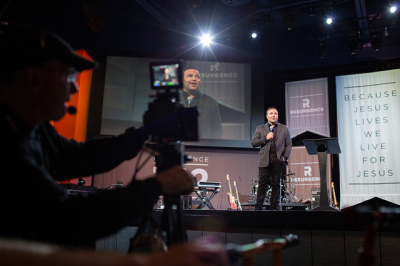 Cameraman focuses in on Pastor Mark Driscoll during Resurgence Conference, Oct. 10, 2012