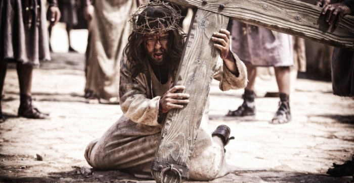 Jesus carries the cross to Golgotha in The History Channel's 'The Bible' on Sunday, March 31, 2013.