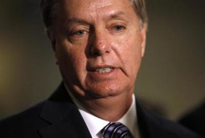 Senator Lindsey Graham (R-SC) speaks to the press following his private meeting with United States U.N. Ambassador Susan Rice about the attack on U.S. diplomats in Benghazi, Libya, on Capitol Hill in Washington, November 27, 2012.