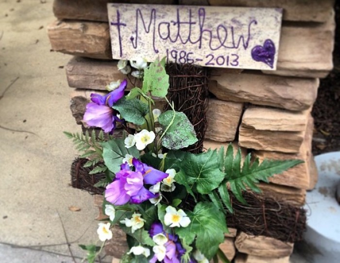 Flowers and cross display is part of a makeshift memorial at Saddleback Church for Pastor Rick Warren's son, Matthew, who took his own life on Friday after a lifelong battle with mental illness, according to his father, April 7, 2013.