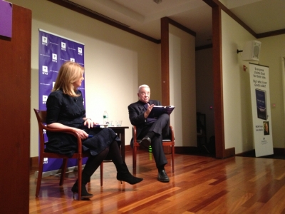 Arianna Huffington, of The Huffington Post (l), looks on as Jim Wallis, president and CEO of Sojourners, discusses his new book, On God's Side, at New York University on April 5, 2013.