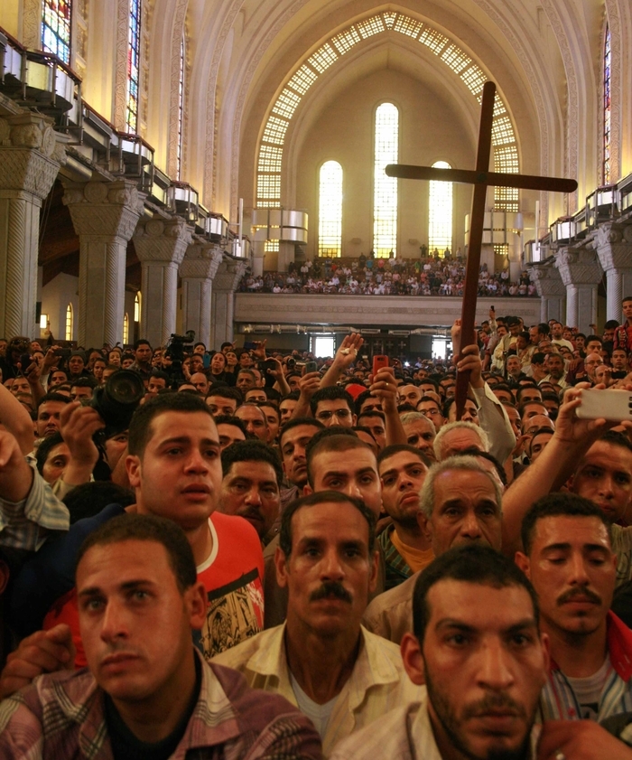 Mourners at St. Mark's Coptic Orthodox Cathedral for funeral of four slain Christians.