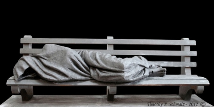 This 7-foot long park bench holds 'Jesus the Homeless' sculpture that pedestrians can sit next to. At first, the sculpture looks like a homeless person, on closer inspection, people can see that it's Jesus Christ.