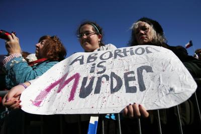 A teenager holds a sign during the Ninth Annual Walk for Life West Coast rally at Civic Center Plaza in San Francisco, California January 26, 2013.