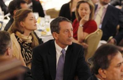 Former South Carolina Governor Mark Sanford (C) is pictured in the audience as U.S. President Barack Obama delivers remarks at the National Prayer Breakfast in Washington February 4, 2010.
