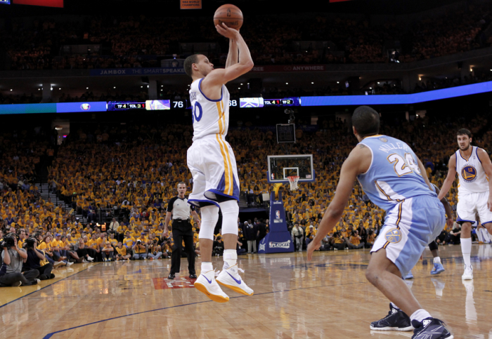 Golden State Warriors' Stephen Curry (L) shoots over Denver Nuggets' Andre Miller (front on R) during Game 4 of their NBA Western Division quarter-final basketball playoffs in Oakland, California April 28, 2013.
