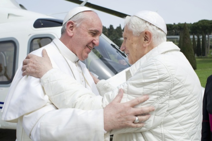Pope Francis embraces emeritus Pope Benedict XVI at the papal summer residence in Castel Gandolfo, Italy, March 23.