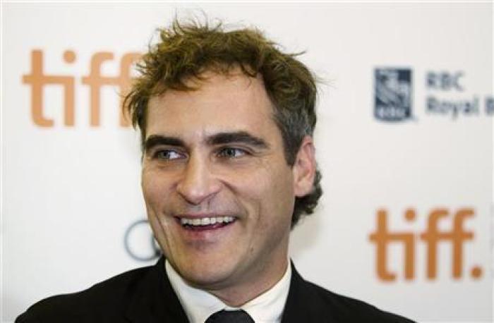 Actor Joaquin Phoenix arrives on the red carpet for the gala presentation of the film ''The Master'' at the 37th Toronto International Film Festival, September 7, 2012.