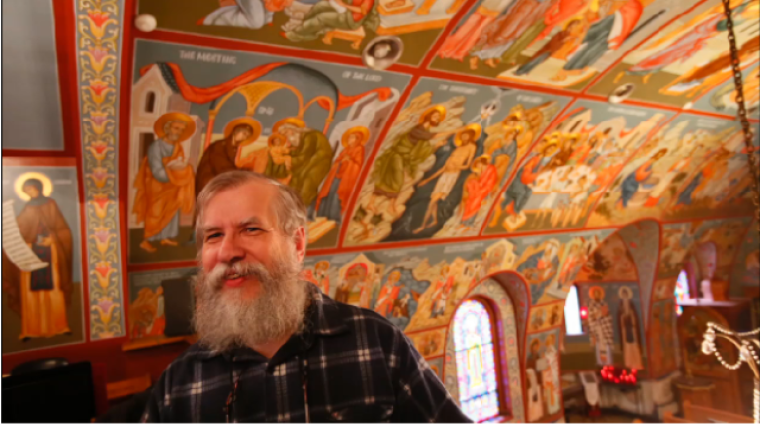 Iconographer Fr. Theodore Jurewicz looks over the icons he painted over the last six years, inside the St. Stephen Serbian Orthodox Church in Lackawanna, N.Y., on Monday, April 1, 2013.