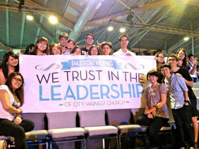 Supporters of City Harvest Church in Singapore appear in an April 2013 public photo on a Facebook page titled 'COC Must Not Remove the 8 Leaders of CHC.'