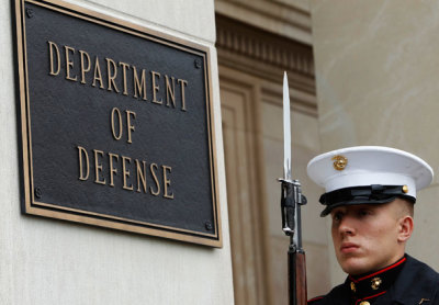 A U.S. Marine, who is part of a military honor guard, takes his position at the Pentagon in Washington April 30, 2013.