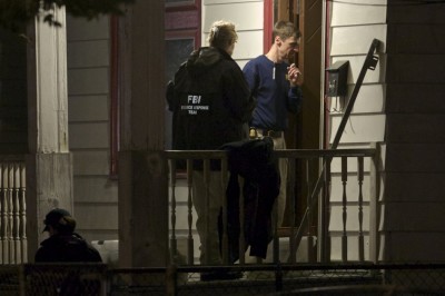 FBI agents search the home where three Cleveland women were found alive after vanishing in Cleveland, Ohio.