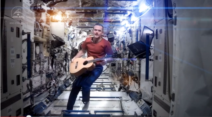 Canadian astronaut Commander Chris Hadfield in a revised version of David Bowie's 1969 song, 'Space Oddity'.