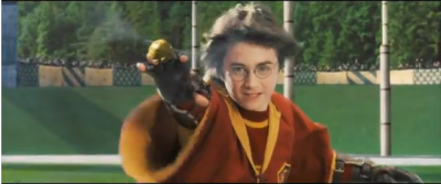 J.K. Rowling's fictional character Harry Potter reaches for the coveted Golden Snitch during a game of quidditch in a scene from the movie, 'Harry Potter and the Sorcerer's Stone'.