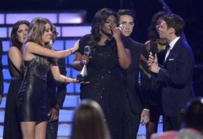 Finalist Candice Glover reacts to being named winner of 'American Idol' during the Season 12 finale in Los Angeles, Calfiornia May 16, 2013.