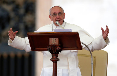 Pope Francis speaks as he leads a Pentecost vigil mass in Saint Peter's Square at the Vatican May 18, 2013.