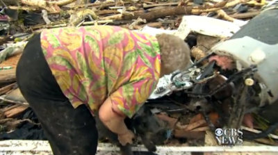 Oklahoma resident Barbara Garcia's pet dog was discovered alive while she was being interviewed in front of her flattened home on Monday, May 20, 2013, after a devastating interview ripped through parts of the state.