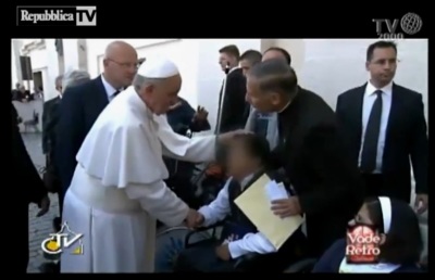 Pope Francis performing an alleged 'exorcism' on a wheelchair-bound man, which the Vatican has denied, on May 19, 2013 at the Vatican.