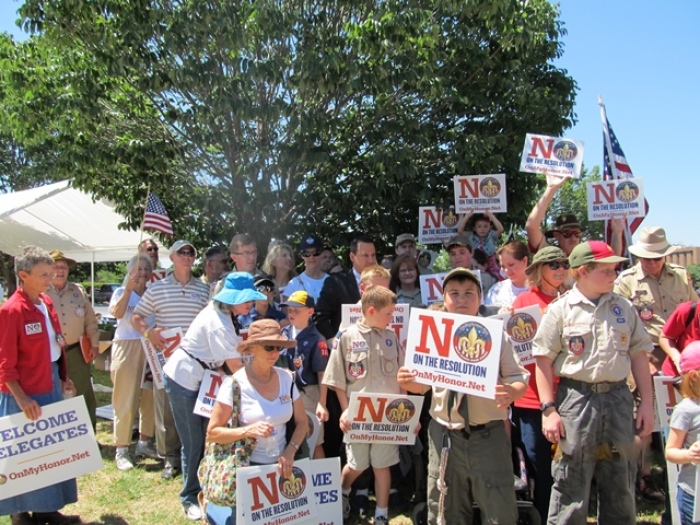 Boy Scouts pose for pictures during their public protest against the BSA's proposed resolution to open membership to homosexual students. A total of 1,400 delegates will be voting on the resolution at the national annual meeting, held this year at the Gaylord Texan in Grapevine, Texas. May 22, 2013.