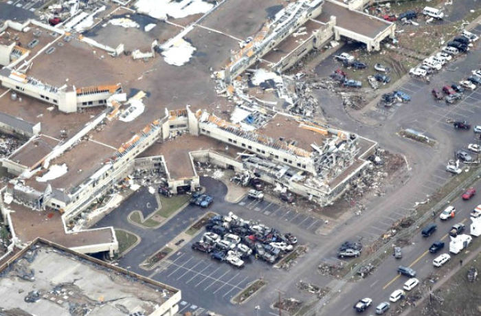 An aerial view of damage at Moore Medical Center in Moore, Okla., is seen on May 21, 2013, in the aftermath of a tornado that killed at least 24 people and injured hundreds of others. None of the 25-30 people at the center were harmed by the storm.
