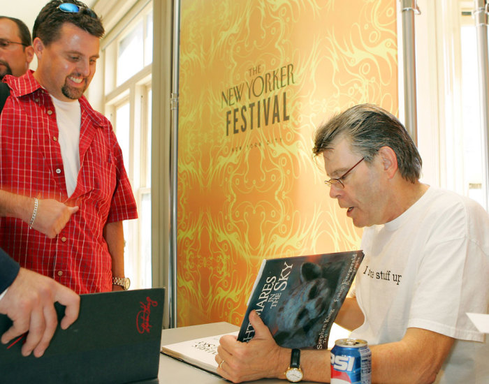 Author Stephen King signs copies of his books, as part of The New Yorker Festival, in New York, September 24, 2005.