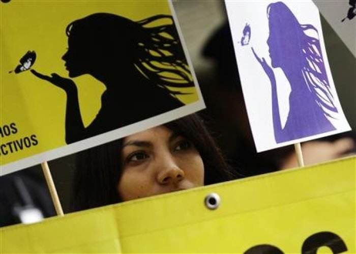 A member of Amnesty International attends a demonstration outside the El Salvador embassy in Mexico City, May 29, 2013, in support of a 22-year-old Salvadoran woman identified as Beatriz, who is seeking an abortion.