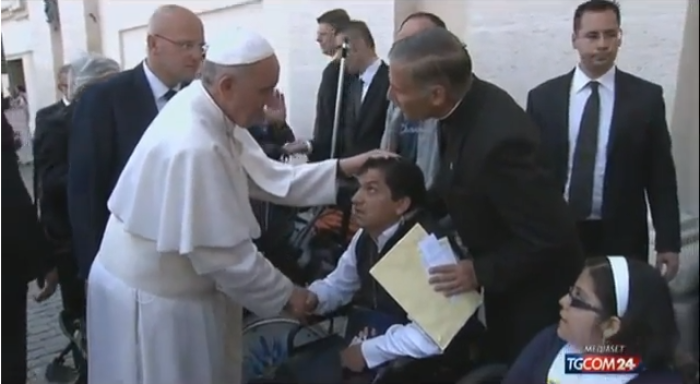 Pope Francis greets Angel V., in St. Peter's Square before praying for him.