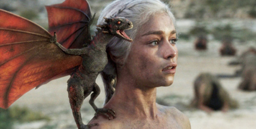 A Dragon perches on the shoulder of Danaerys Targaryen (Emilia Clarke), "The Mother of Dragons"