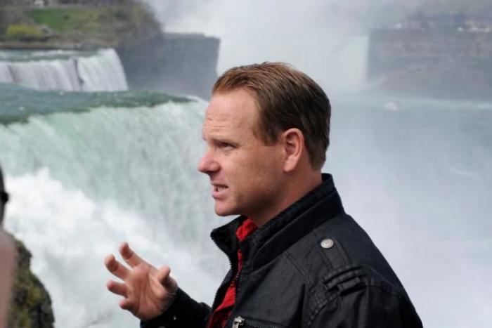 Nik Wallenda speaks about his wire walk over the Canadian (Horseshoe) Falls, as he stands beside the American Falls on May 2 in Niagara Falls, N.Y.
