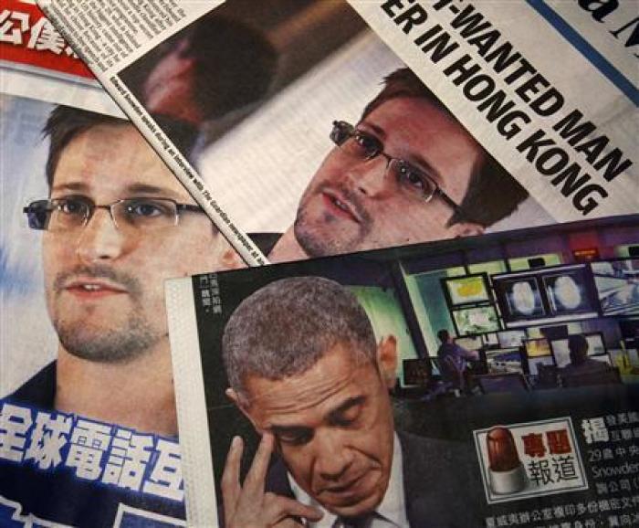 Photos of Edward Snowden, a contractor at the National Security Agency (NSA), and U.S. President Barack Obama are printed on the front pages of local English and Chinese newspapers in Hong Kong in this illustration photo June 11, 2013.