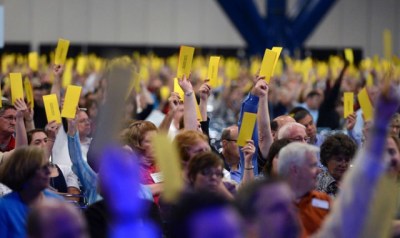 Messengers of the Southern Baptist Convention cast votes to approve a resolution on the Boy Scouts that expresses 'opposition to and disappointment in the decision of the Boy Scouts of America to change its membership policy' to allow homosexual members. The resolution does not take a position as to whether churches should disassociate with the Scouts, but it does urge churches that do sever ties 'not to abandon their ministry to boys but consider expanding their Royal Ambassadors ministry.'