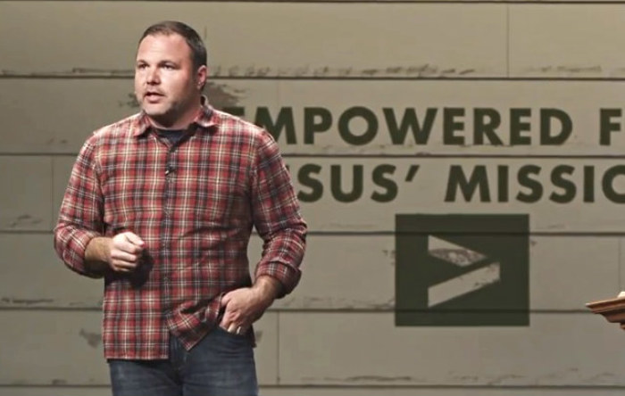 Mark Driscoll preaches at one of Mars Hill Church's campus. In 2012, approximately 14,000 people attended services at Mars Hill Church locations weekly.