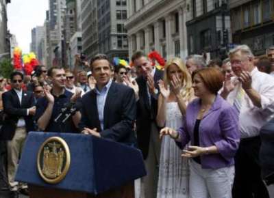 New York Governor Andrew Cuomo speaks to reporters before taking part in the Gay Pride Parade in New York June 26, 2011.