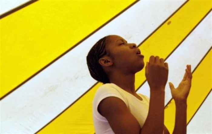 Shavon Gardner, 17, sings with the Redeemed Christian Church of God youth choir at Redemption Camp in Floyd, Texas June 17, 2009