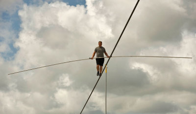 High wire walker Nik Wallenda balances on a 1,200 foot (366 meter) cable during a practice session in Sarasota, Florida, June 14, 2013. Wallenda is training for his untethered high wire walk across the Grand Canyon scheduled for June 23.