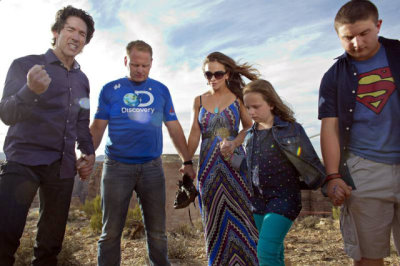 Preacher Joel Osteen, left, leads prayer with Nik Wallenda and family before the tightrope artist successfully walks 1,400 feet across the Little Colorado River Gorge near the Grand Canyon for Discovery Channel's 'Skywire Live With Nik Wallenda' on Sunday, June 23, 2013.