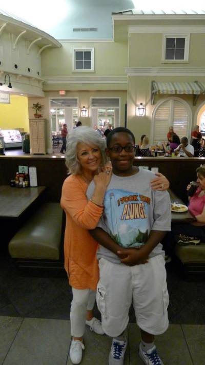Celebrity chef Paula Deen poses with a young boy in Horshoe, Indiana, Ind. in June, 2013.