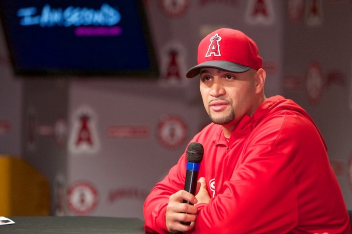 Los Angeles Angels first baseman Albert Pujols takes questions from reporters during debut of his 'I Am Second' video at Angel Stadium in Anaheim, July 2, 2013.
