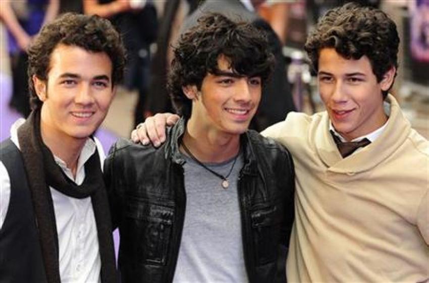 Kevin Jonas (L), Joe Jonas (C) and Nick Jonas of the Jonas Brothers arrive for the UK Premiere of their movie "Jonas Brothers: The 3D Concert Experience" at Leicester Square in central London May 13, 2009.