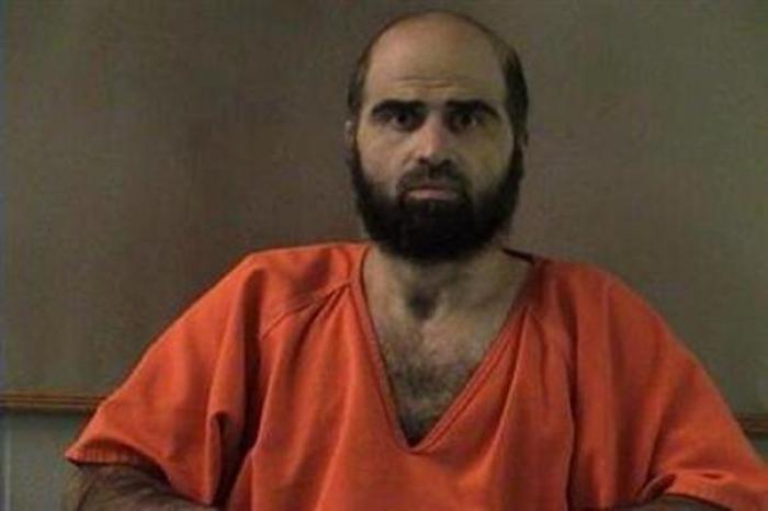 Nidal Hasan, charged with killing 13 people and wounding 31 in a November 2009 shooting spree at Fort Hood, is pictured in an undated handout photo obtained by Reuters June 29, 2012.