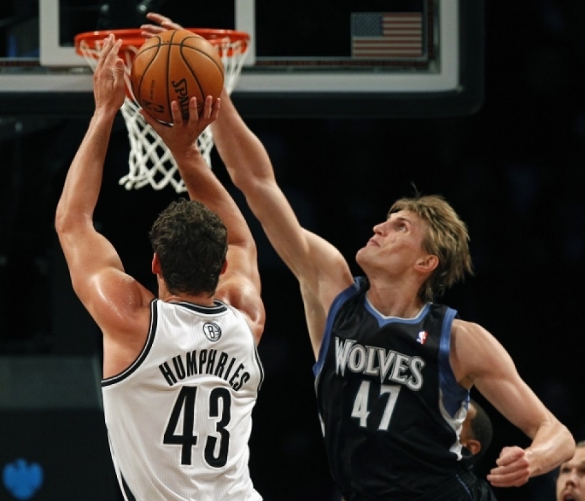 Andrei Kirilenko blocks the shot of forward, Kris Humphries.