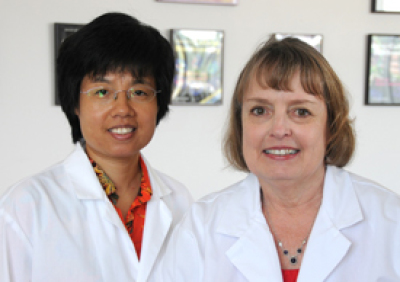 Jun Jiang, PhD (left) and Jeanne Lawrence, PhD are among the authors of a study in Nature finding that the extra chromosome in trisomy 21, better known as Down syndrome, can be silenced in a cell culture