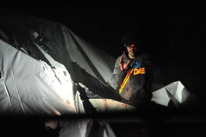 This image taken by Sgt. Sean Murphy of the Massachusetts State Police and published by Boston Magazine on Thursday shows Boston Marathon bombing suspect Dzhokhar Tsarnaev emerging from the boat where he was captured in April.