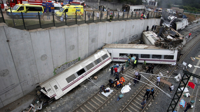 Rescue workers pull victims from a train crash near Santiago de Compostela in northwestern Spain.
