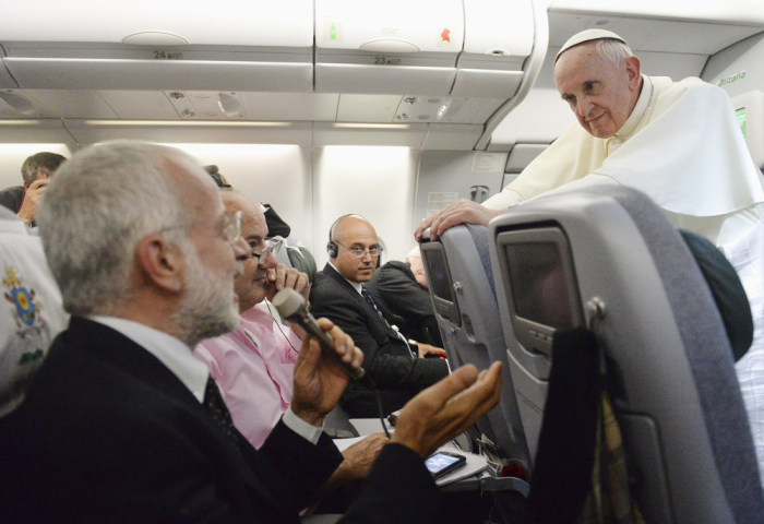 Pope Francis listens to a journalist's question as he flies back to Rome following his visit to Brazil July 29, 2013. Pope Francis, in some of the most conciliatory words from any pontiff on gays, said they should not be judged or marginalized for their orientation and should be integrated into society, but he reaffirmed Church teaching that homosexual acts are a sin. In a broad-ranging 80-minute conversation with journalists on the plane bringing him back from a week-long visit to Brazil, Francis also said the Roman Catholic Church's ban on women priests was definitive, although he would like them to have more leadership roles in administration and pastoral activities.