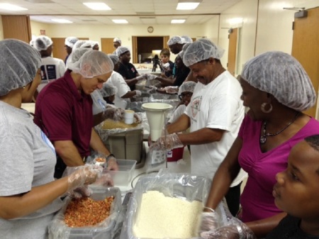 Volunteers at Peace Missionary Baptist Church in Durham, North Carolina package about 10,000 meals to go to the needy in developing countries.